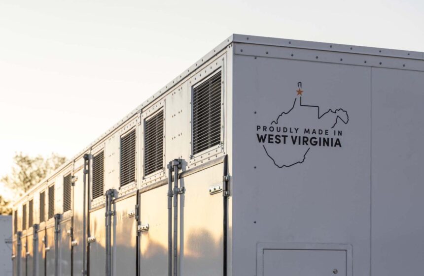 A grid-scale battery stands against a clear sky.