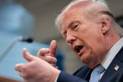 Trump speaking at White House podium about tariffs